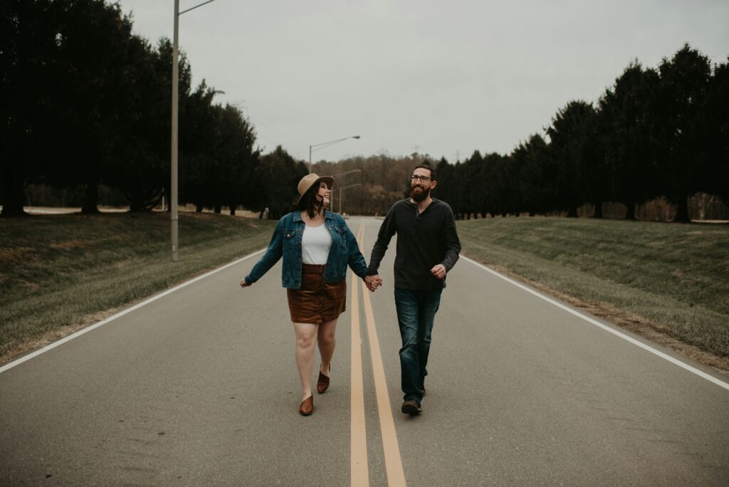 young couple walking down the street together
