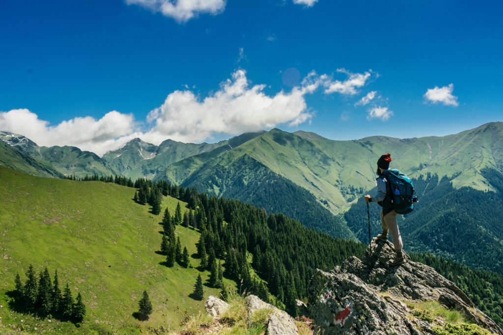 man hiking at top of mountain