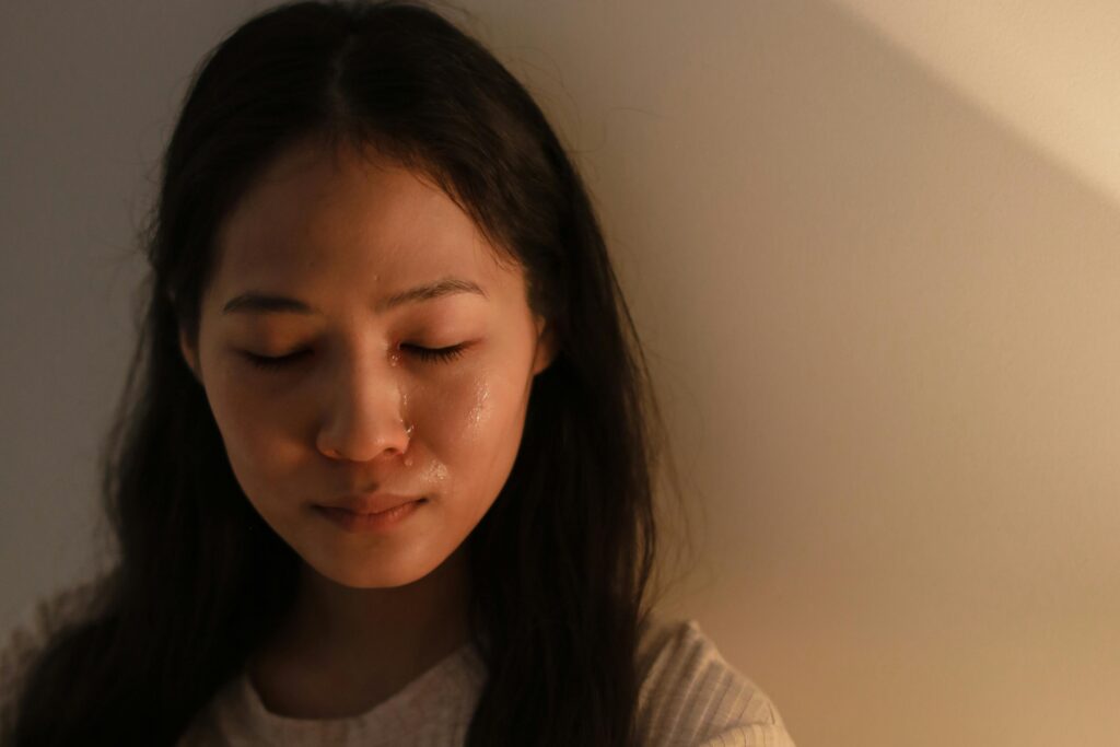 young woman crying from grief