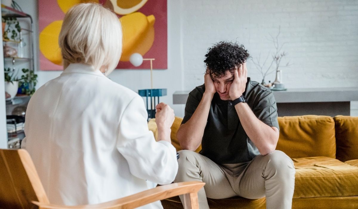 young man talking to woman in therapy