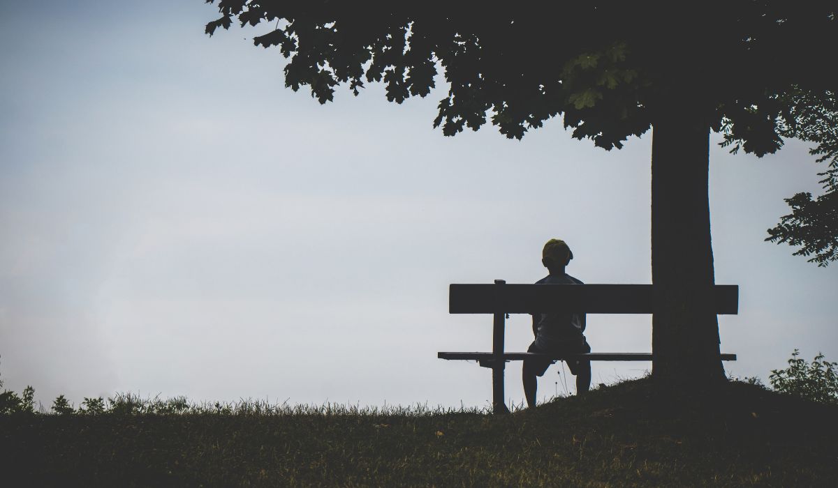 person sitting on bench